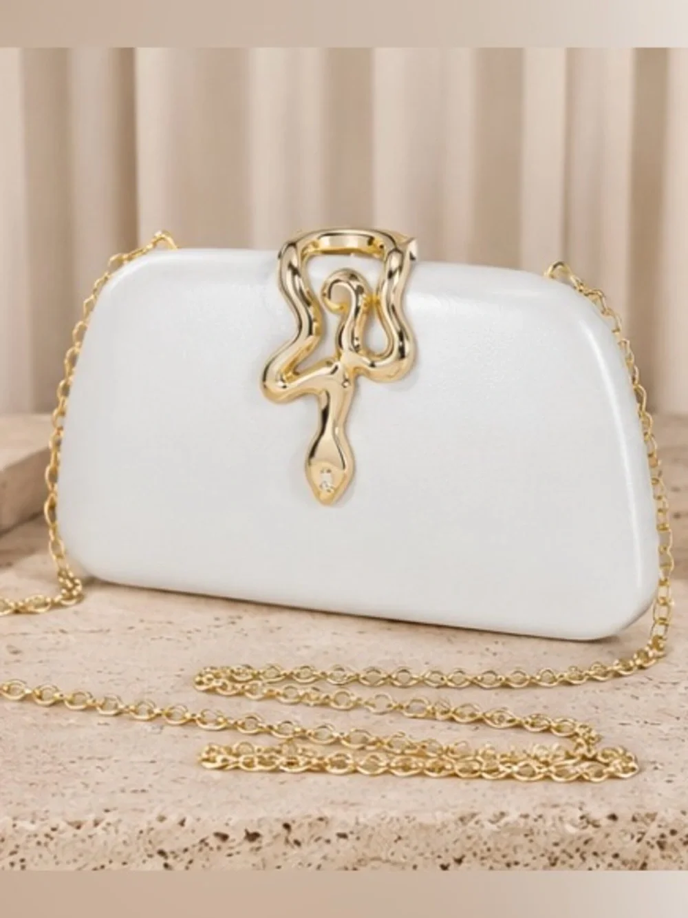 Elegant White Clutch with Gold Snake Accent